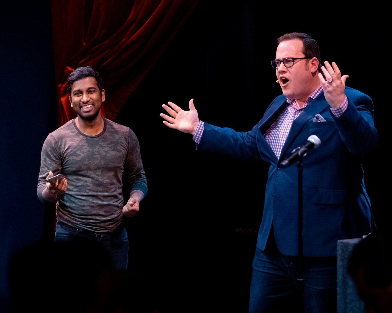 Scott Green on stage at the Chicago Magic Lounge with a volunteer