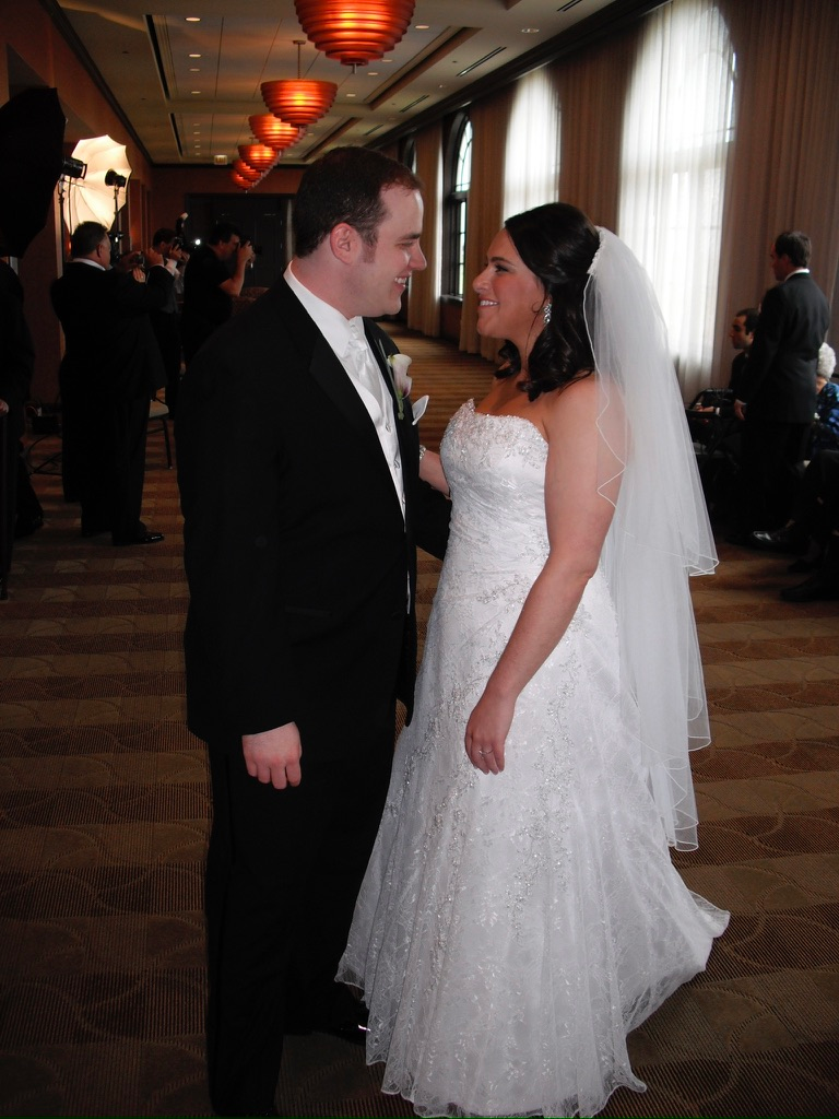 Scott Green and his wife facing each other on their wedding day