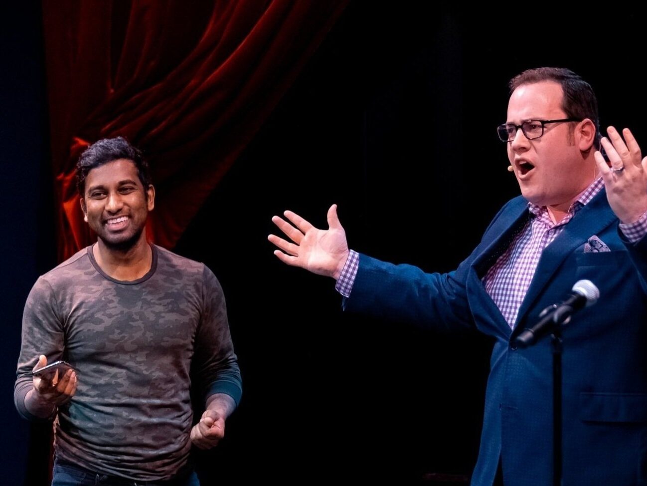 Scott Green on stage with a volunteer at Chicago Magic Lounge