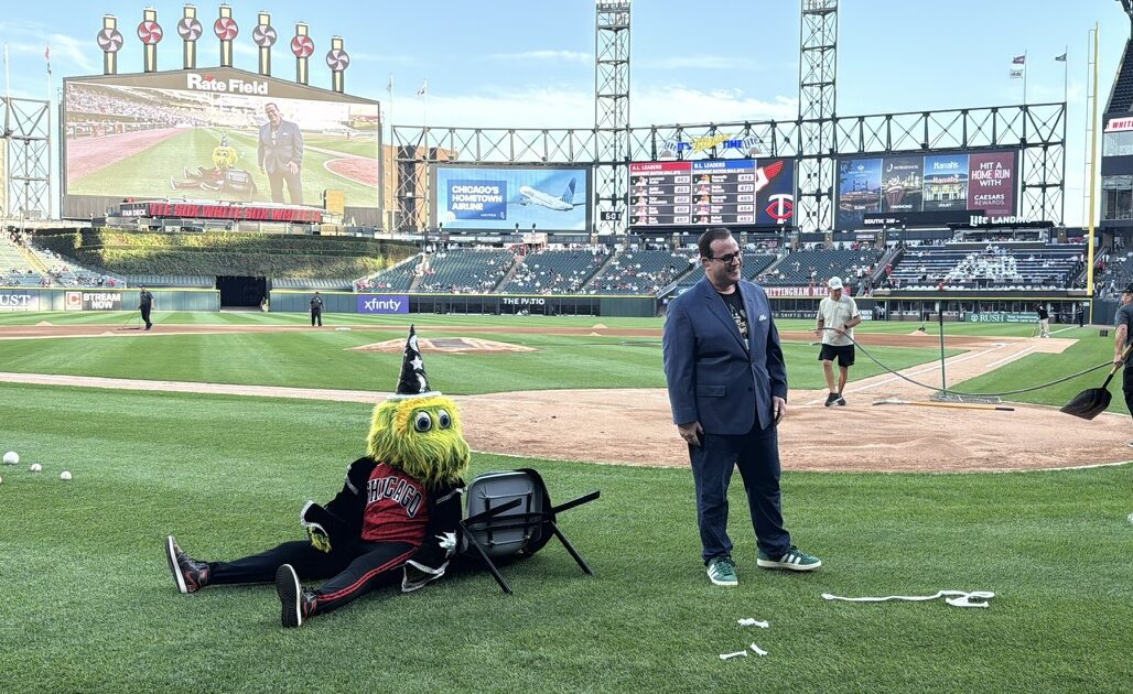 Scott Green on the field at Rate Field with Southpaw