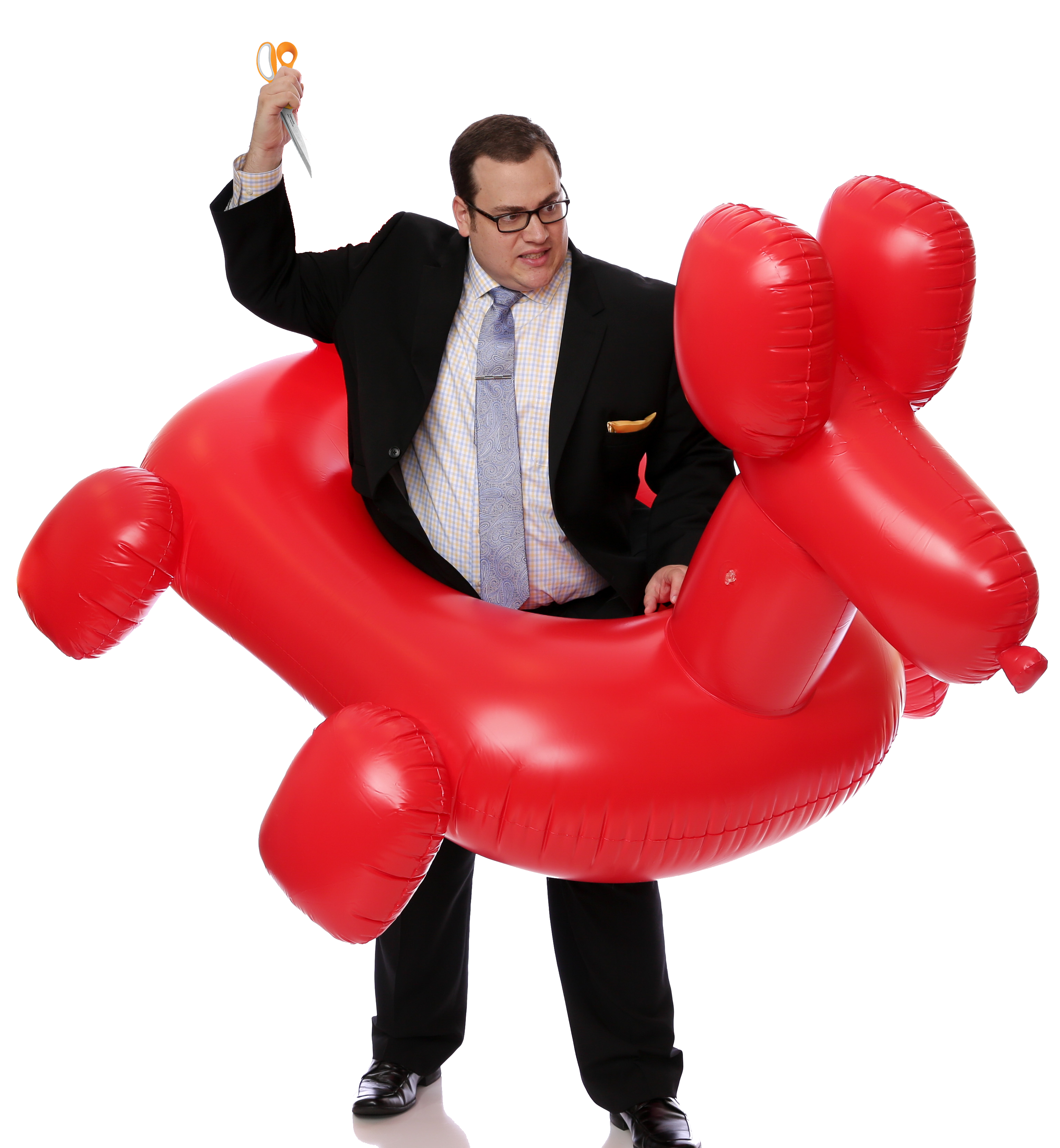 Scott Green with scissors and a giant balloon dog
