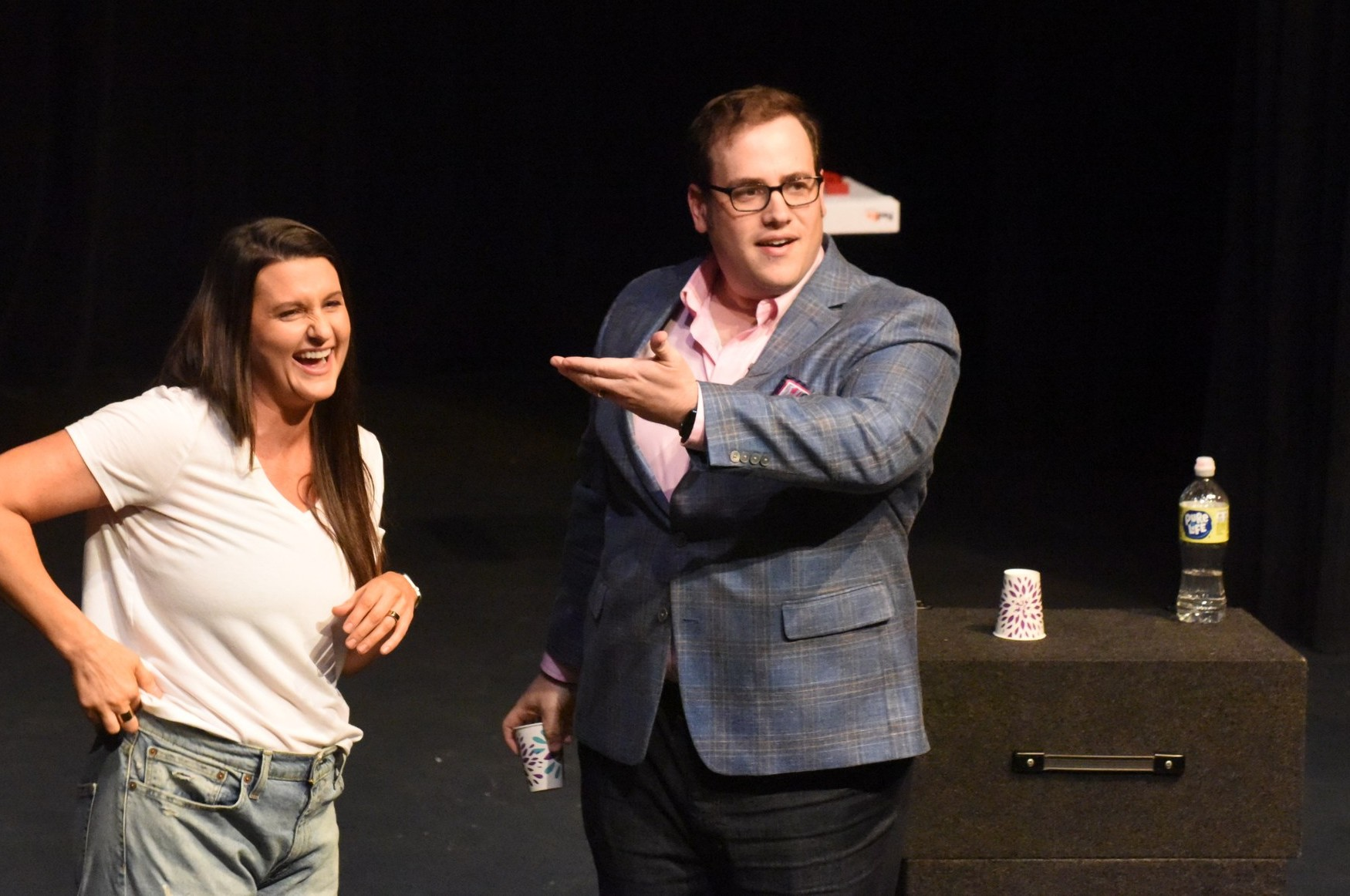 Scott Green with a volunteer on stage